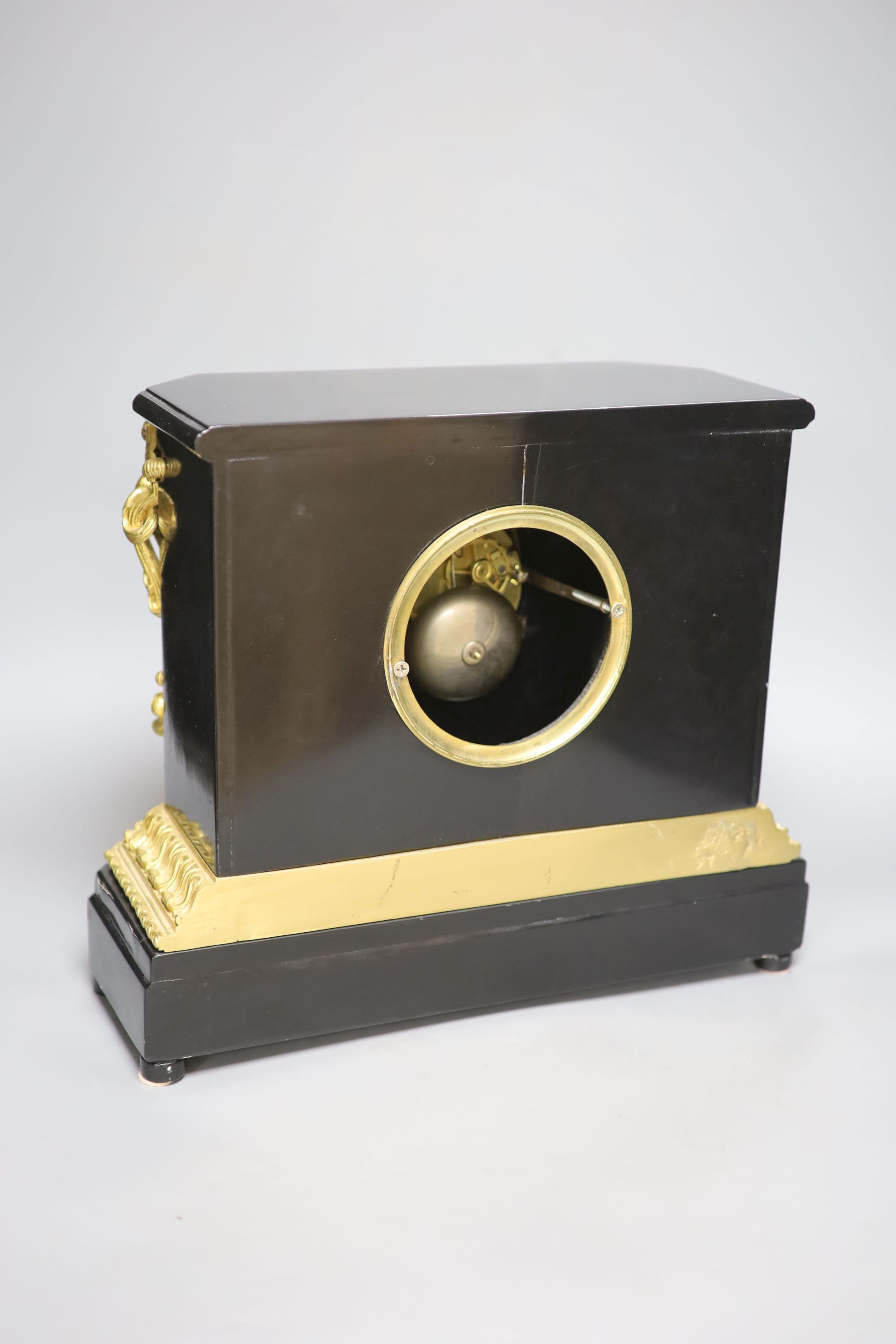 A late 19th century French ebonised and ormolu mounted mantel clock, height 33cm